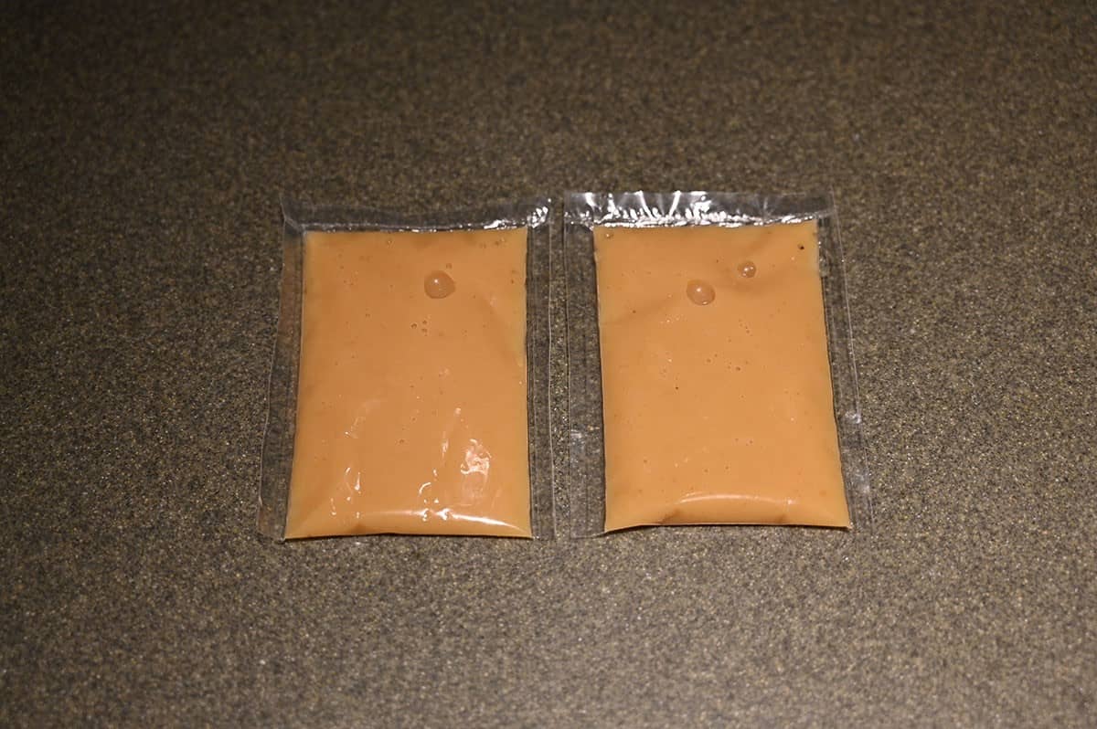Two dipping sauce packets shown on a counter. 