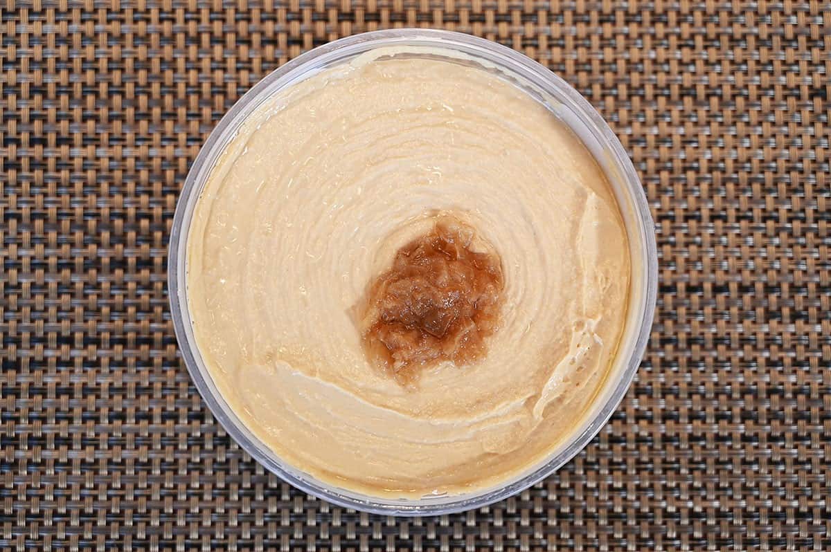 Image of the Costco caramelized onion hummus with the lid off so you can see what the hummus looks like. 