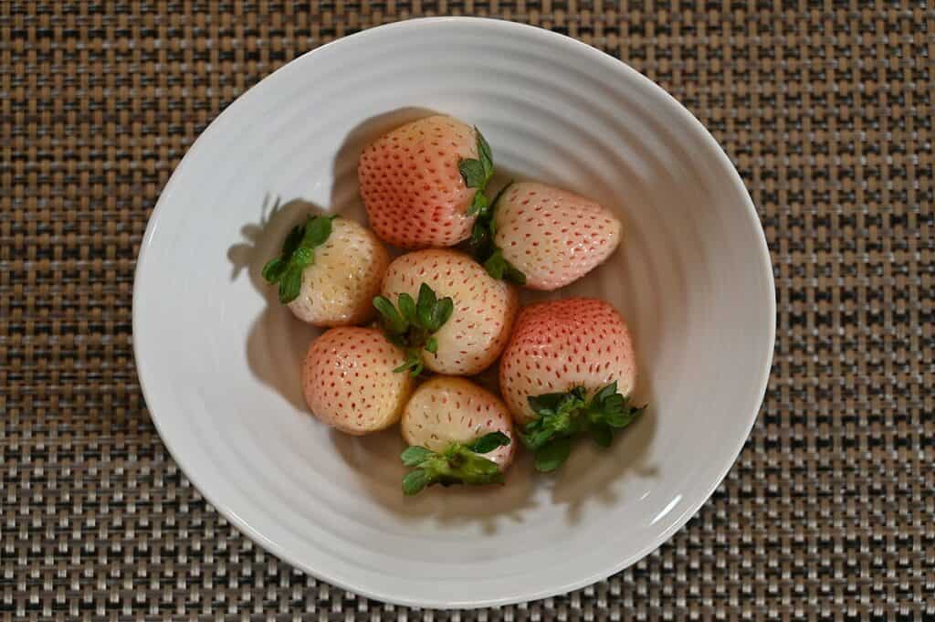Costco Wish Farms Pink-A-Boo Pineberries in a white bowl. 