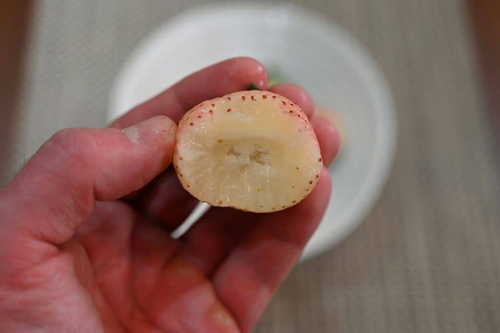 One Costco pineberry with a bite taken out so you can see the middle. 