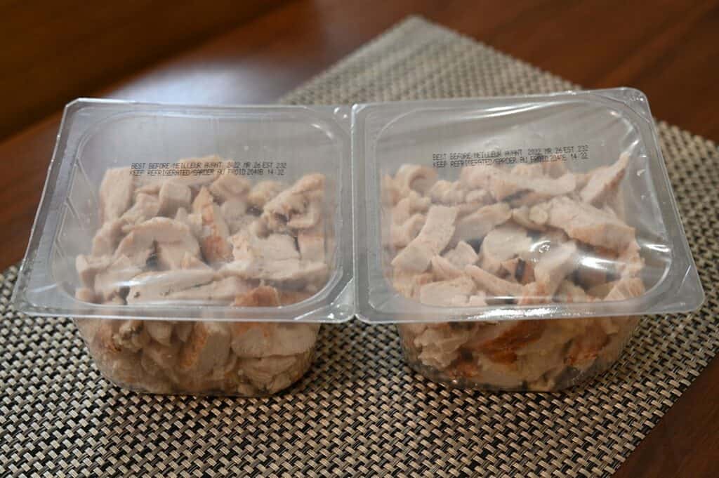 Costco Pinty's Oven Roasted Chicken Breast Strips out of carboard and placed on a table in the plastic package before opening. 