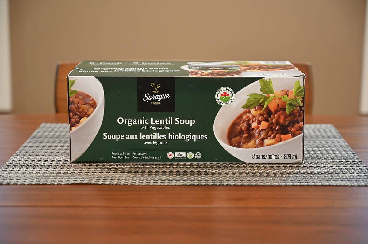 Image of the case of Costco organic lentil soup sitting on a table. 
