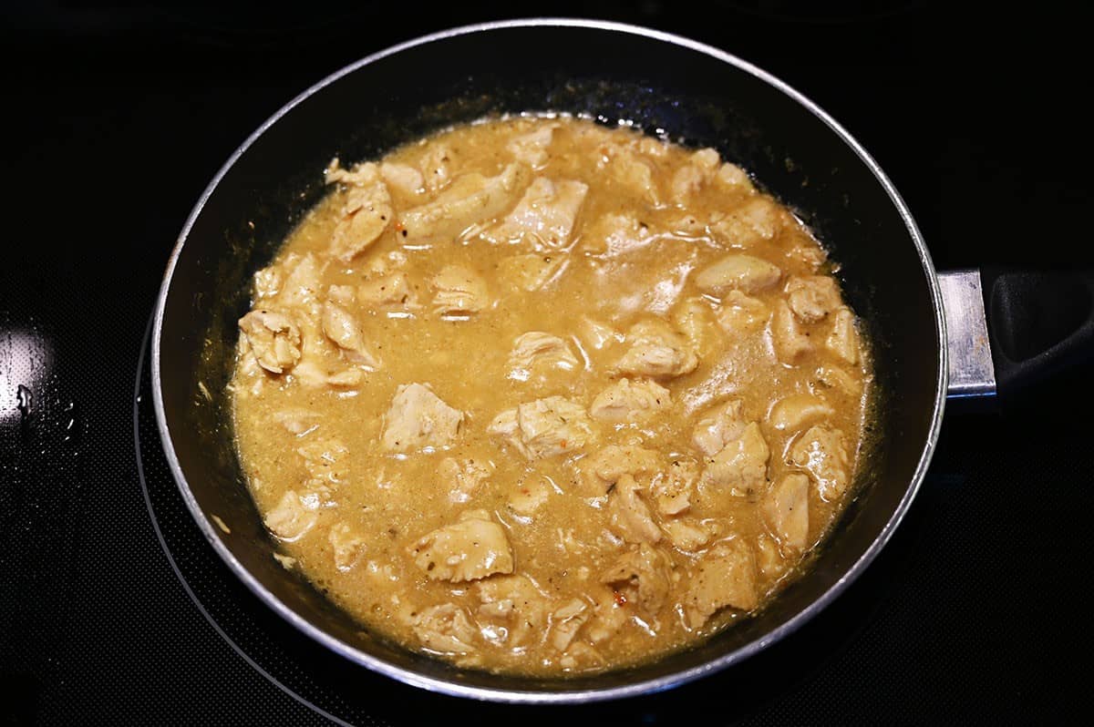 Costco Stoney Creek Thai Coconut Chicken being cooked in a medium sized skilled. 