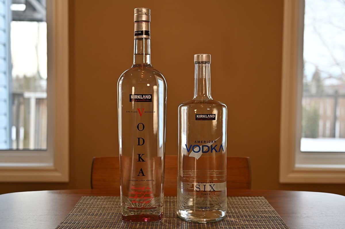 Image of Costco Kirkland Signature French Vodka on the left and American on the right sitting on a table. 