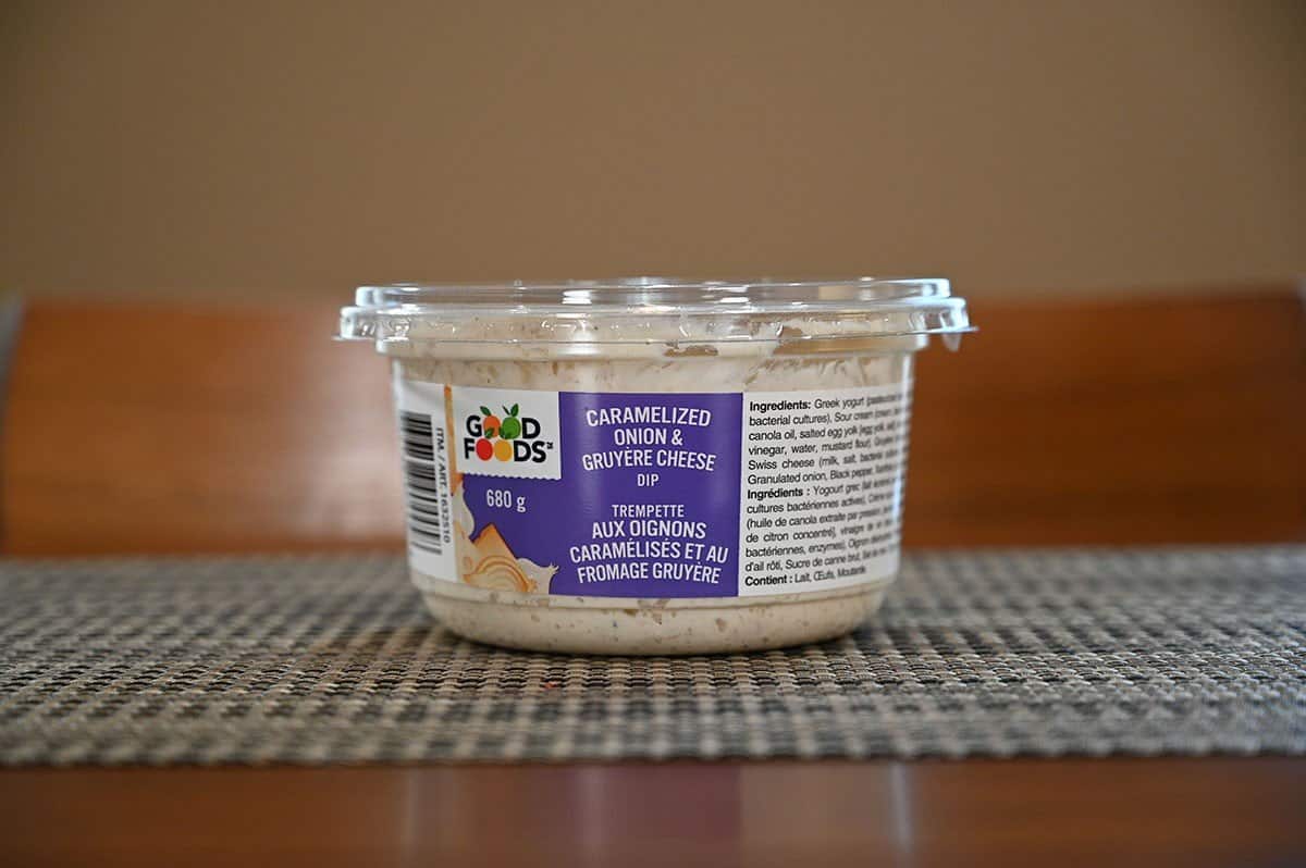 Costco Good Foods Caramelized Onion & Gruyere Cheese Dip container sitting on a table.