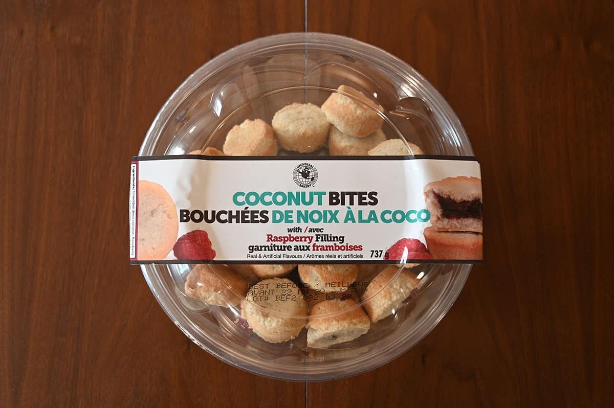 Costco Universal Bakery Coconut Bites container sitting on a table, top down image. 
