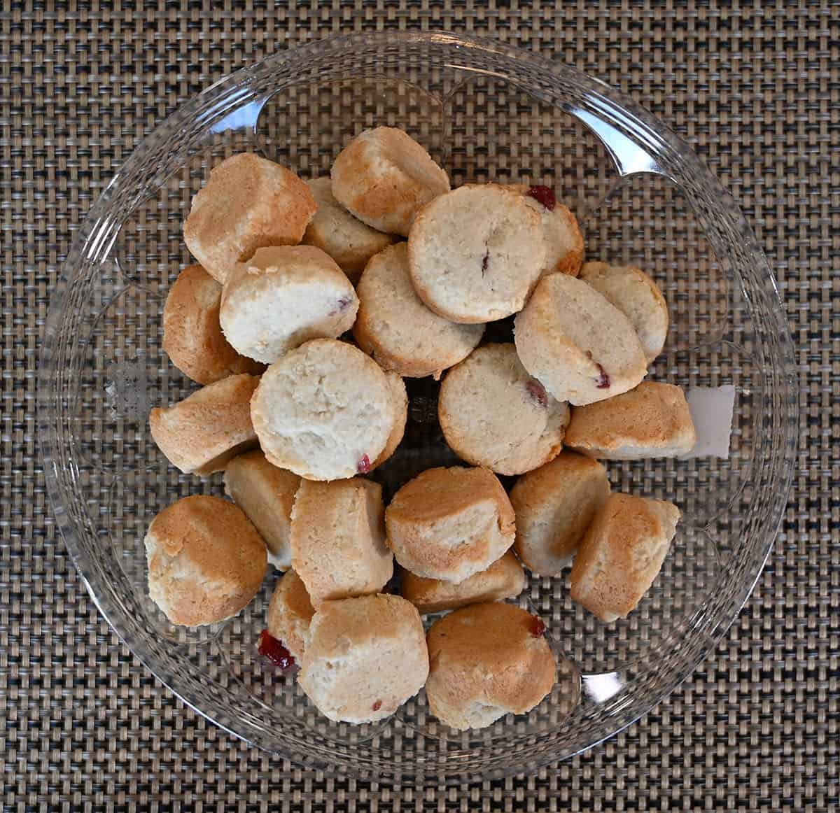 Costco Universal Bakery Coconut Bites container with the lid off showing all the bites, top down image. 