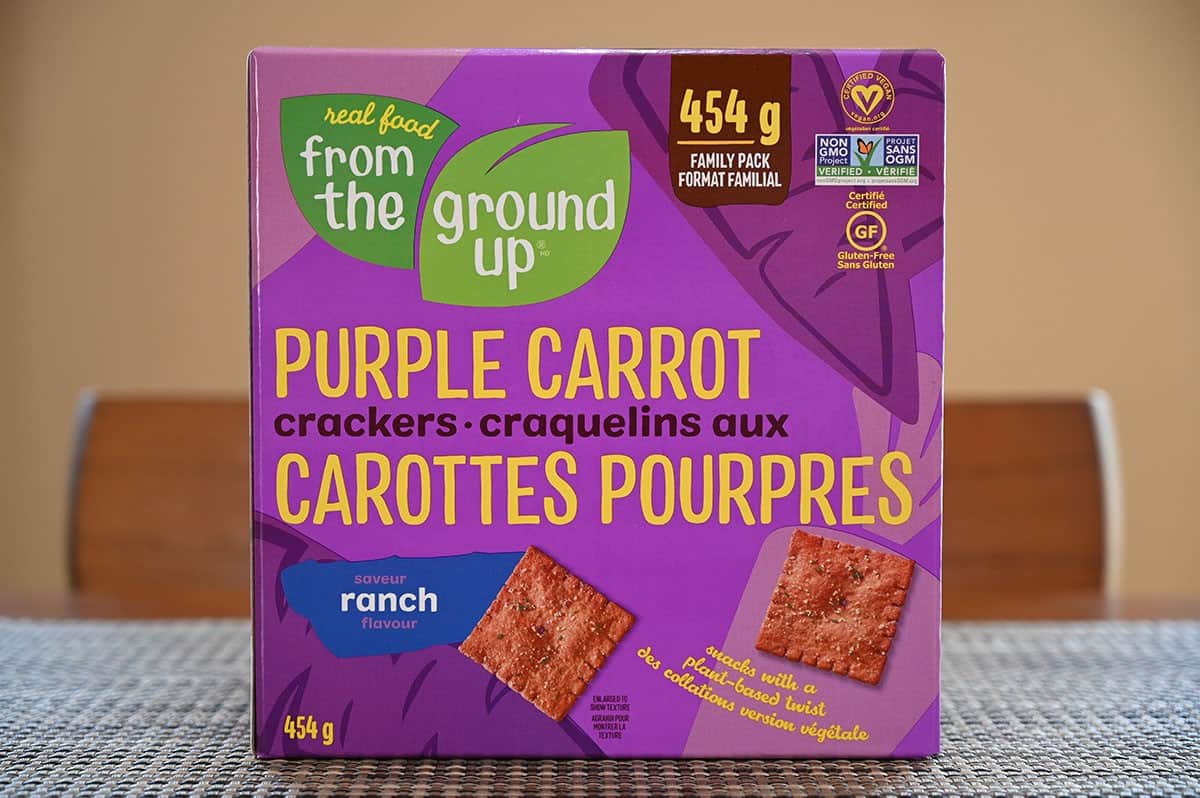 Image of Costco From The Ground Up Purple Carrot Crackers box sitting on a table. 