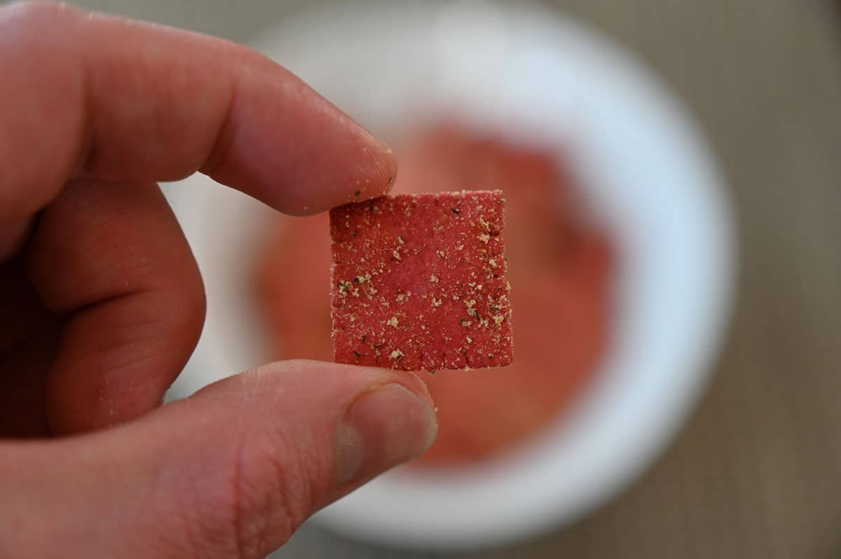 Closeup image of one Costco From The Ground Up Purple Carrot Cracker. 