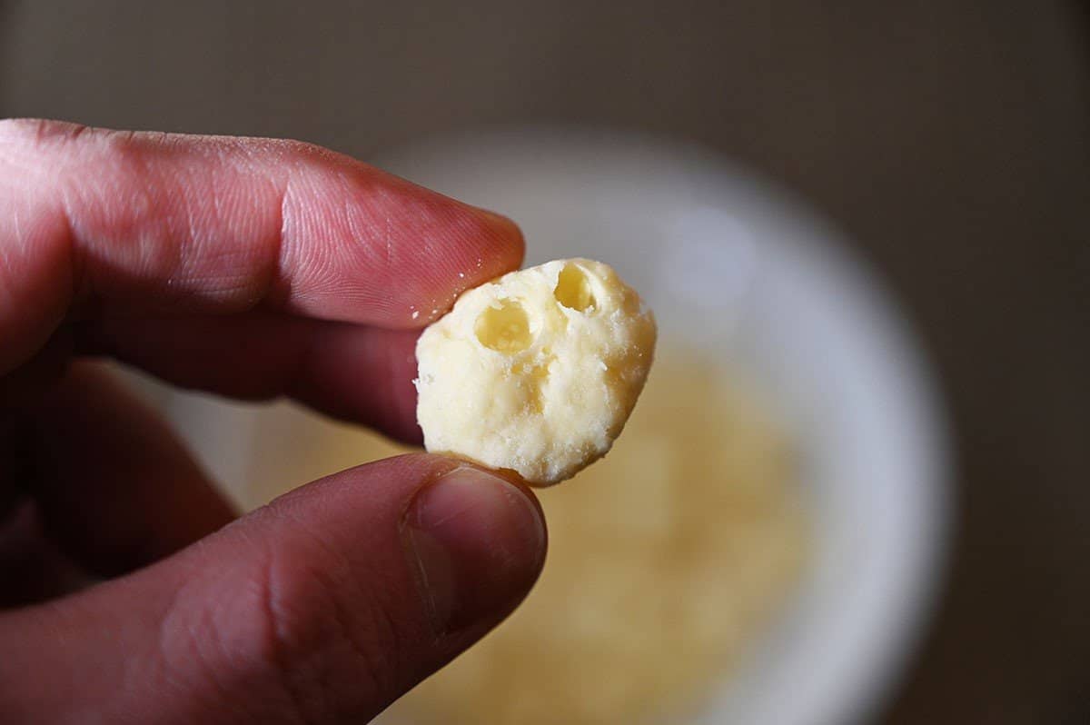 Close up image of one piece of Costco Moon Cheese. 