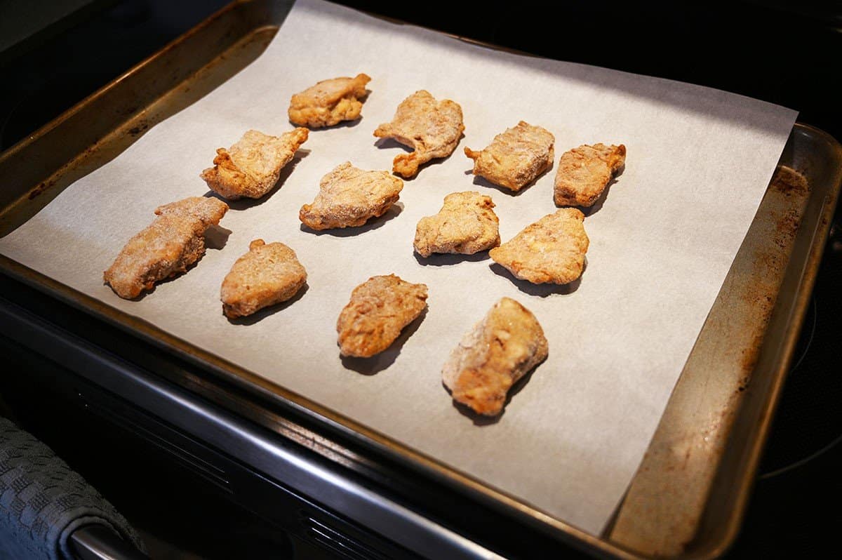 Costco Hampton House Dry Garlic Ribs on a baking sheet lined with parchment paper before cooking. 