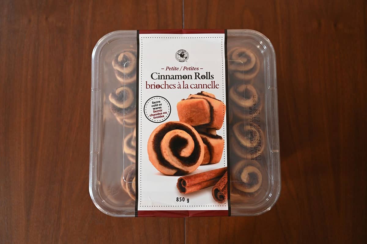 Costco Universal Bakery Petite Cinnamon Rolls container sitting on a table. 