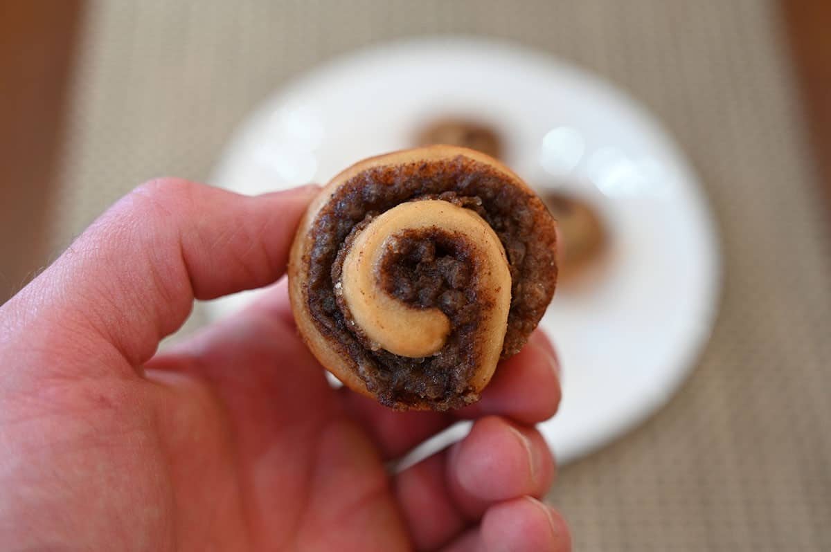 Costco Universal Bakery Petite Cinnamon Roll, closeup image of one cinnamon roll. 