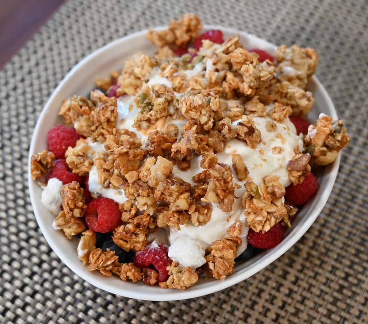 Image of a fruit and yogurt bowl with Costco Kirkland Signature Granola on top. 