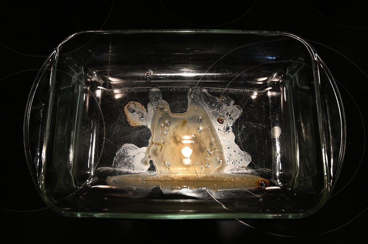 Image of the baking dish after the ham has been cooked and removed from the dish, showing very little fat/grease left. 