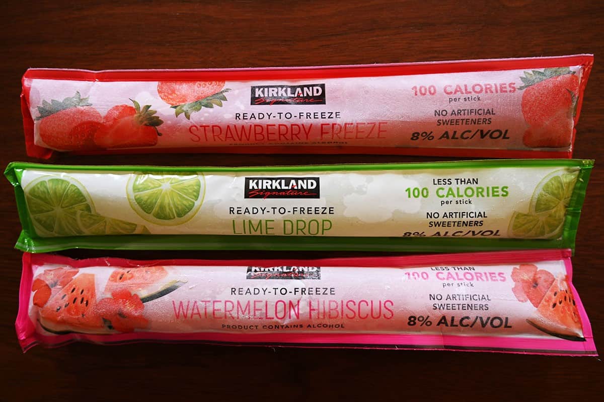 All three flavors of the Costco Kirkland Signature Frozen Cocktail tubes frozen and on a table, top down image. 