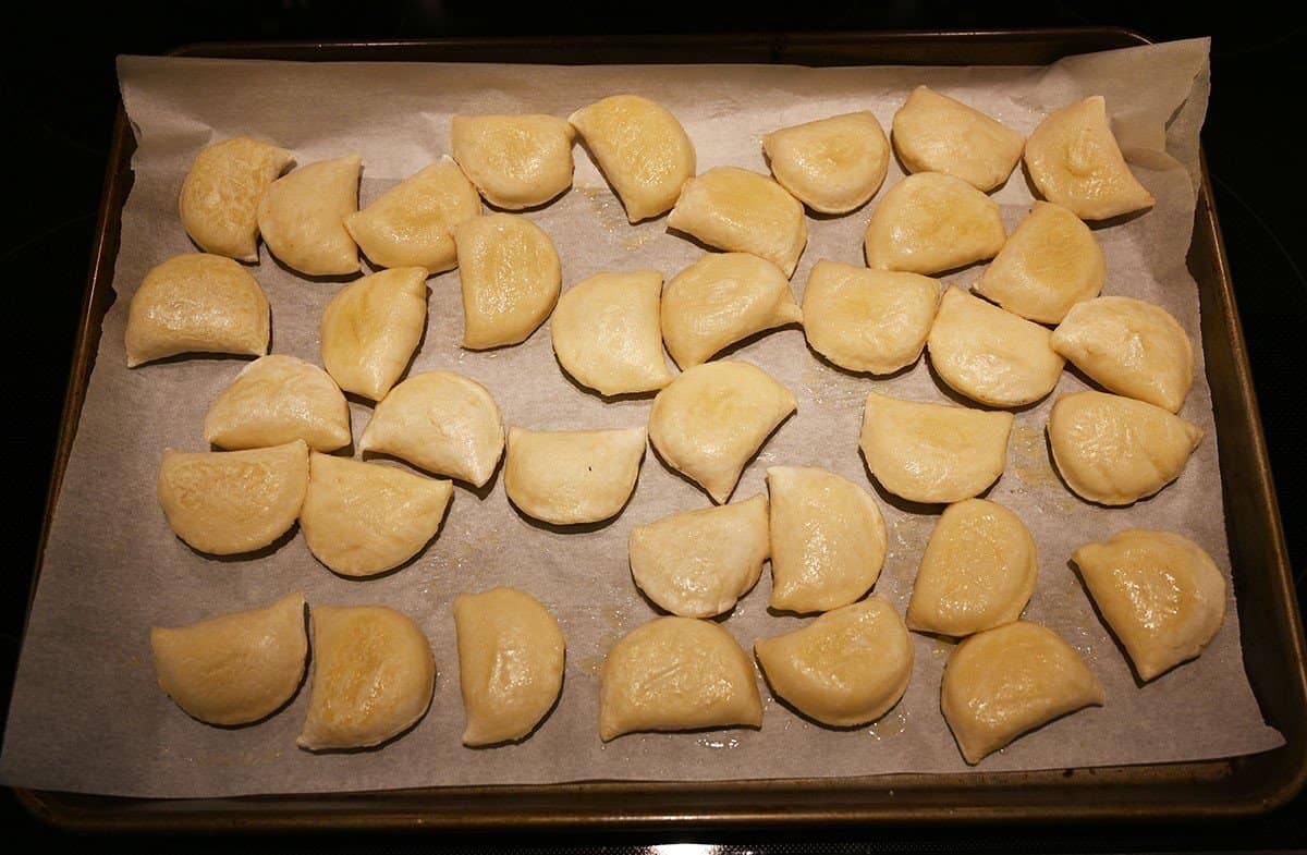 Image of the Costco Naleway Potato and White Cheddar Perogies being cooked in the oven. 