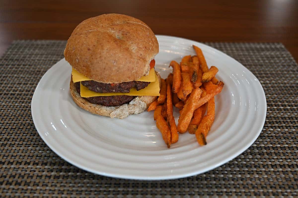 Image of a double cheeseburger and sweet potato fries on a white plate using the Costco bison burgers.