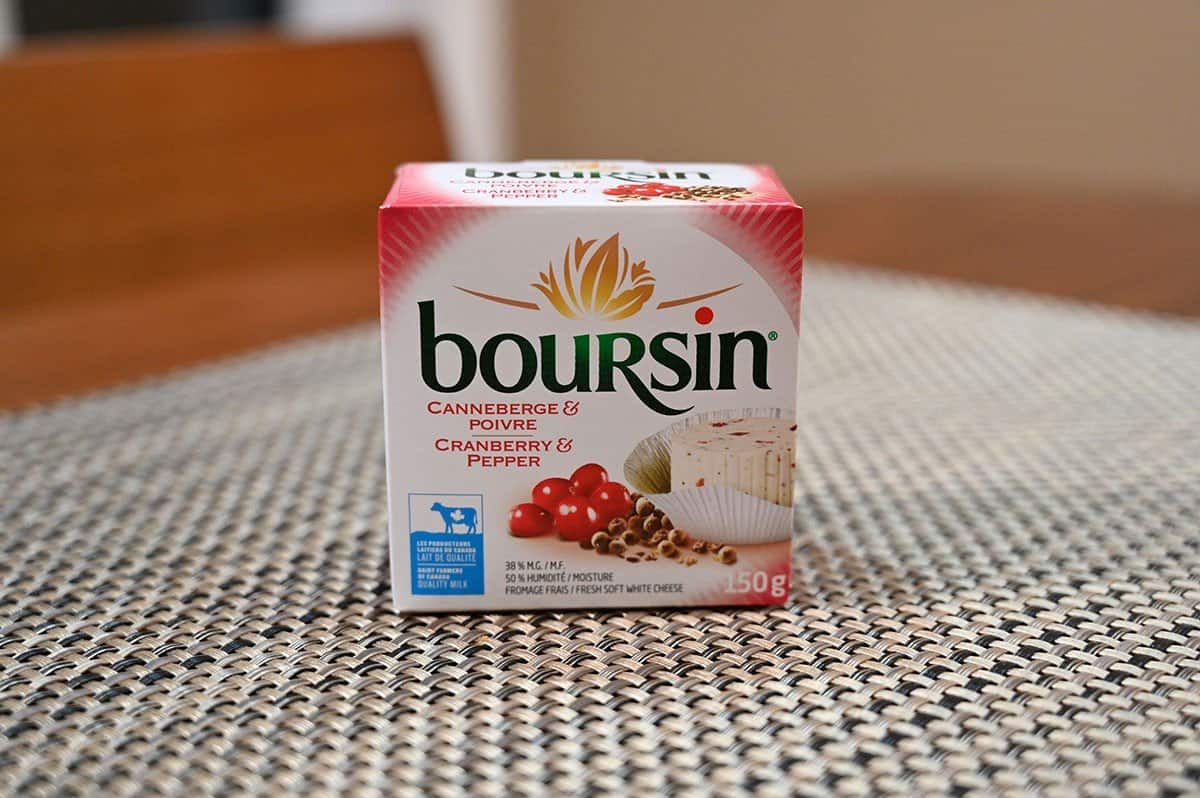 Box of Costco Boursin Cranberry & Pepper flavor sitting on a table. 