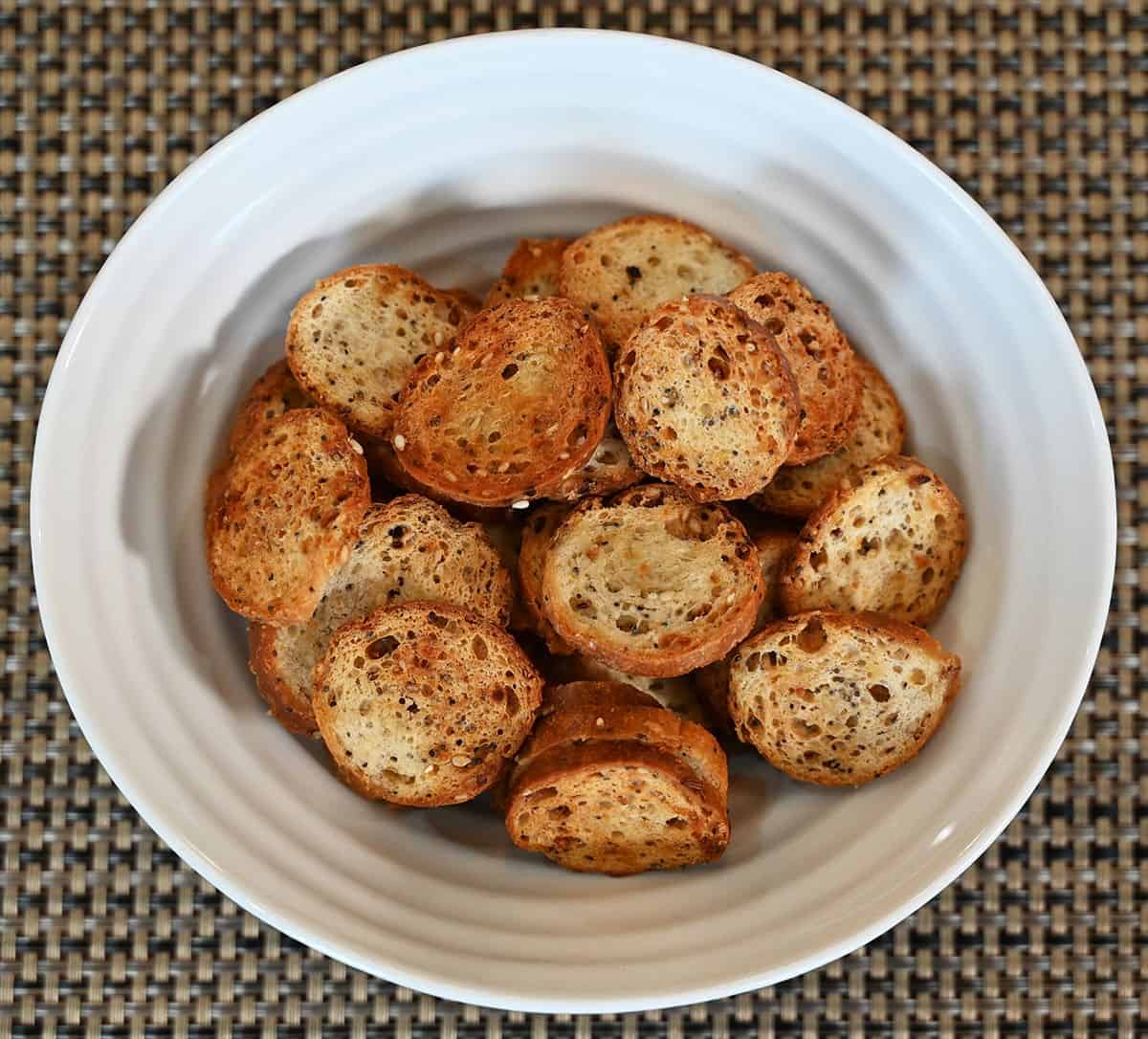 Costco Schwartz Brothers Everything Bagel Chips poured into a white bowl, top down image. 