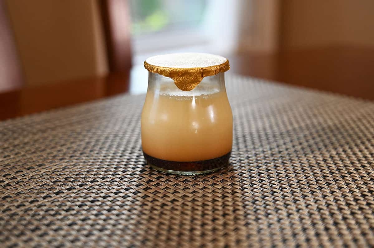 Costco Marie Morin Caramel Flan jar sitting on a table. Closeup image. 