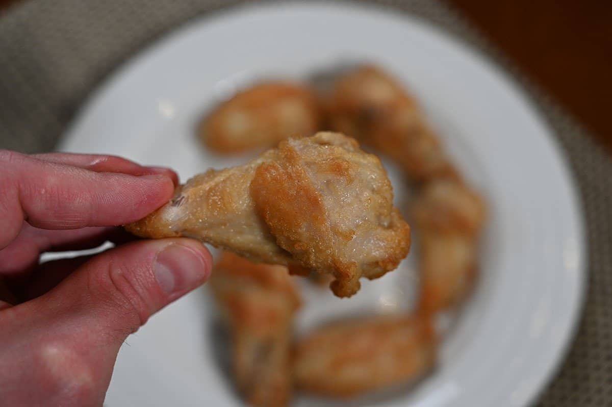 Closeup image of one Costco Pinty's Crispy Chicken Wings drumstick. 