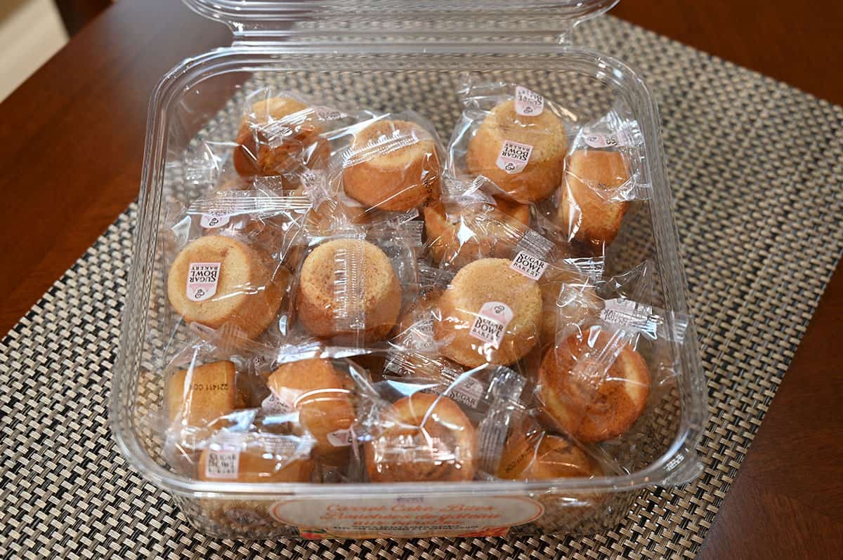 Container of Costco Sugar Bowl Bakery Carrot Cake Bites with the lid off showing the individually packaged bites.