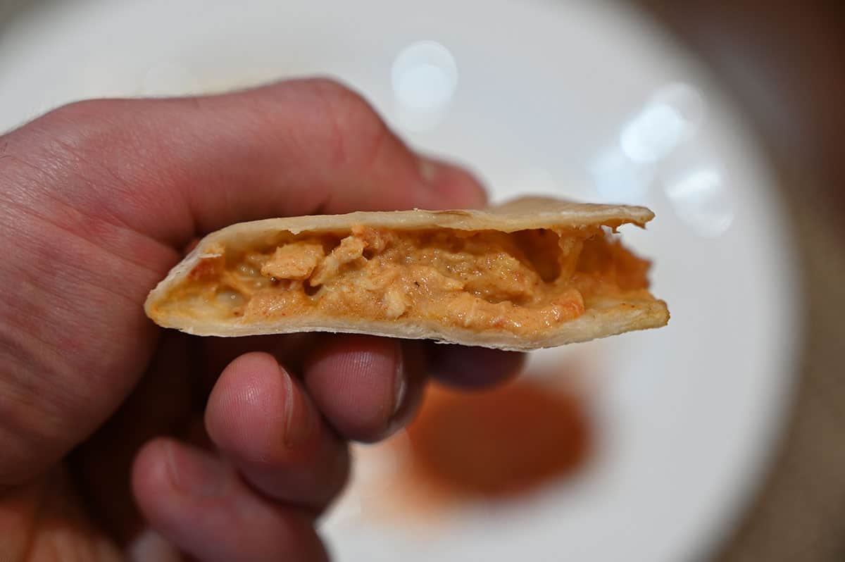 Closeup image of the inside of a Costco Catarina Chicken Quesadilla showing the filling.