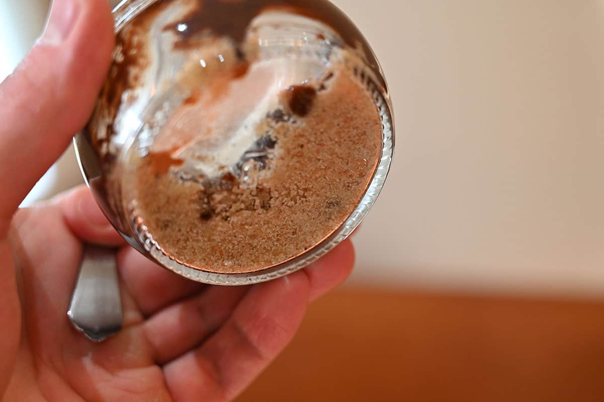 Image of the bottom of the Costco delici Chocolate S'mores Soufflé glass container showing the graham crackers in the botton. 