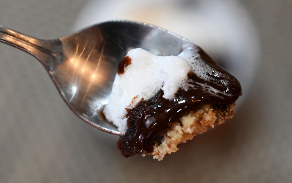 Closeup image of one spoonful of Costco delici Chocolate S'mores Soufflé showing the three different layers.