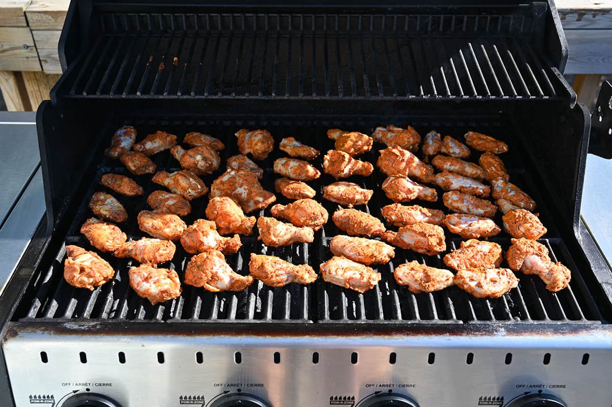 Image of the Costco seasoned chicken wings on the barbecue before being cooked.