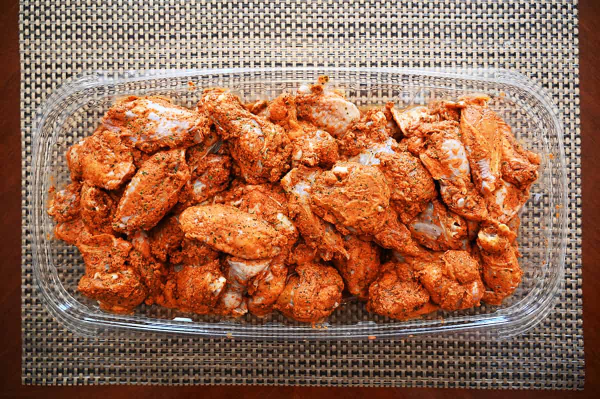 Image of the Costco chicken wings in the tray with the lid off before cooking them.