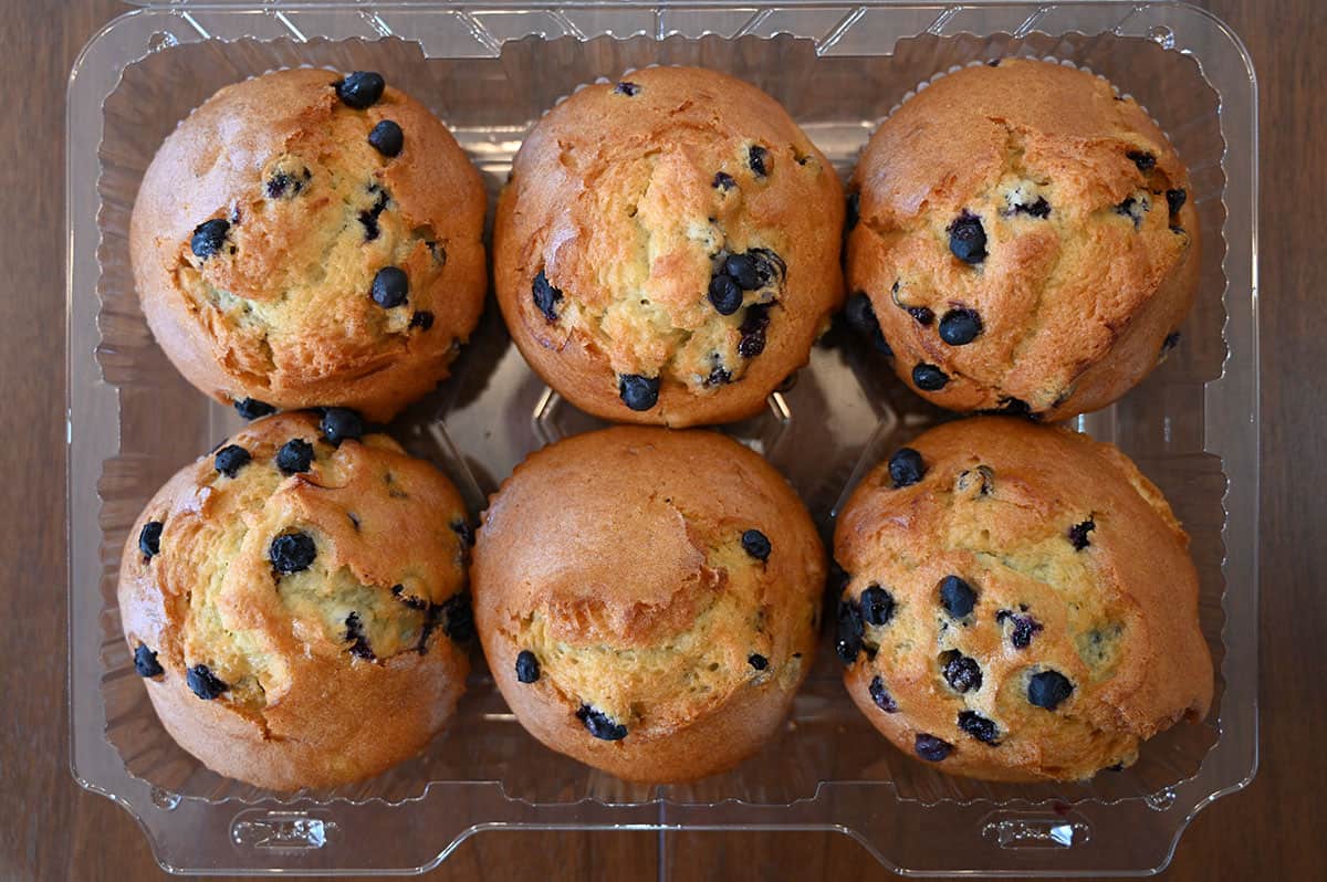 Top down image of the six pack of Costco blueberry muffins with the lid off.