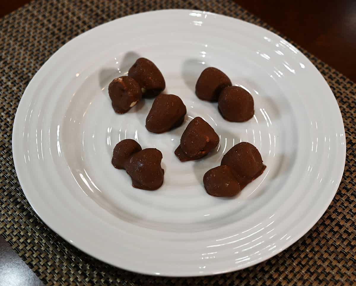 An image of a white plate full of Costco Tru Fru Frozen Chocolate Covered Strawberries.