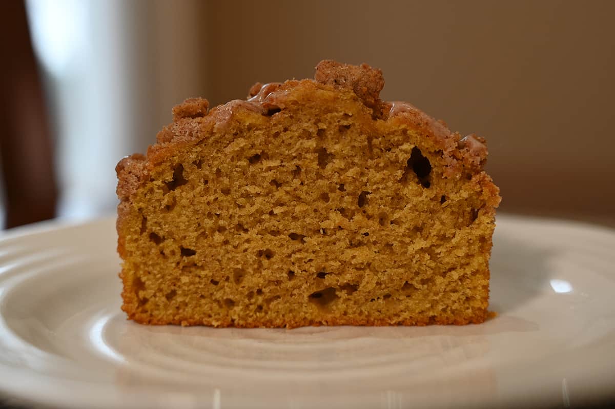 Apple crumb muffin cut in half so you can see the middle.