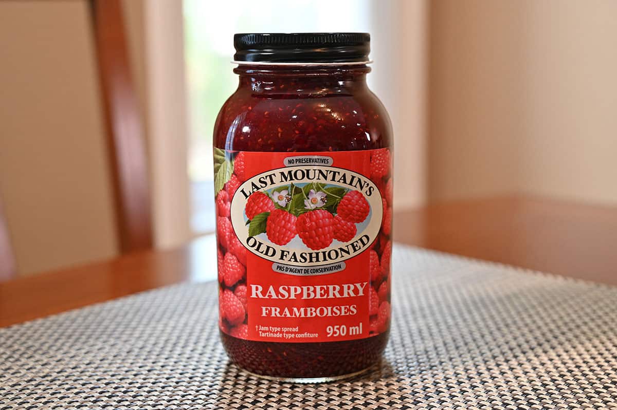 Costco Last Mountain's Old Fashioned Raspberry Jam jar on a table.