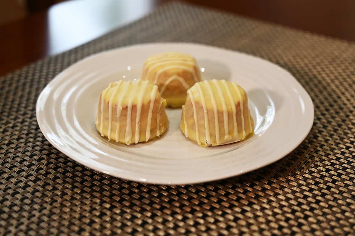 Image of three lemon bites served on a white plate.
