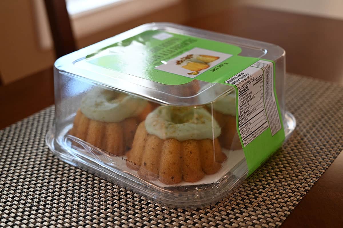 Side view of the mini bundts package, on a table.