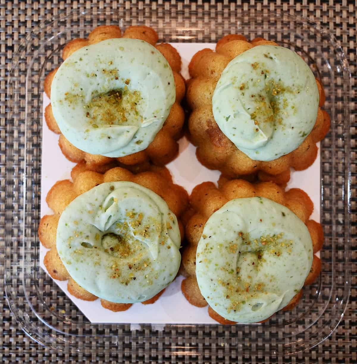 Top down image of the four mini bundts in the package with the lid off.