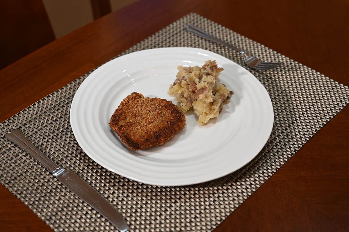 Image of a plate of schnitzel with mashed potatoes on the side.