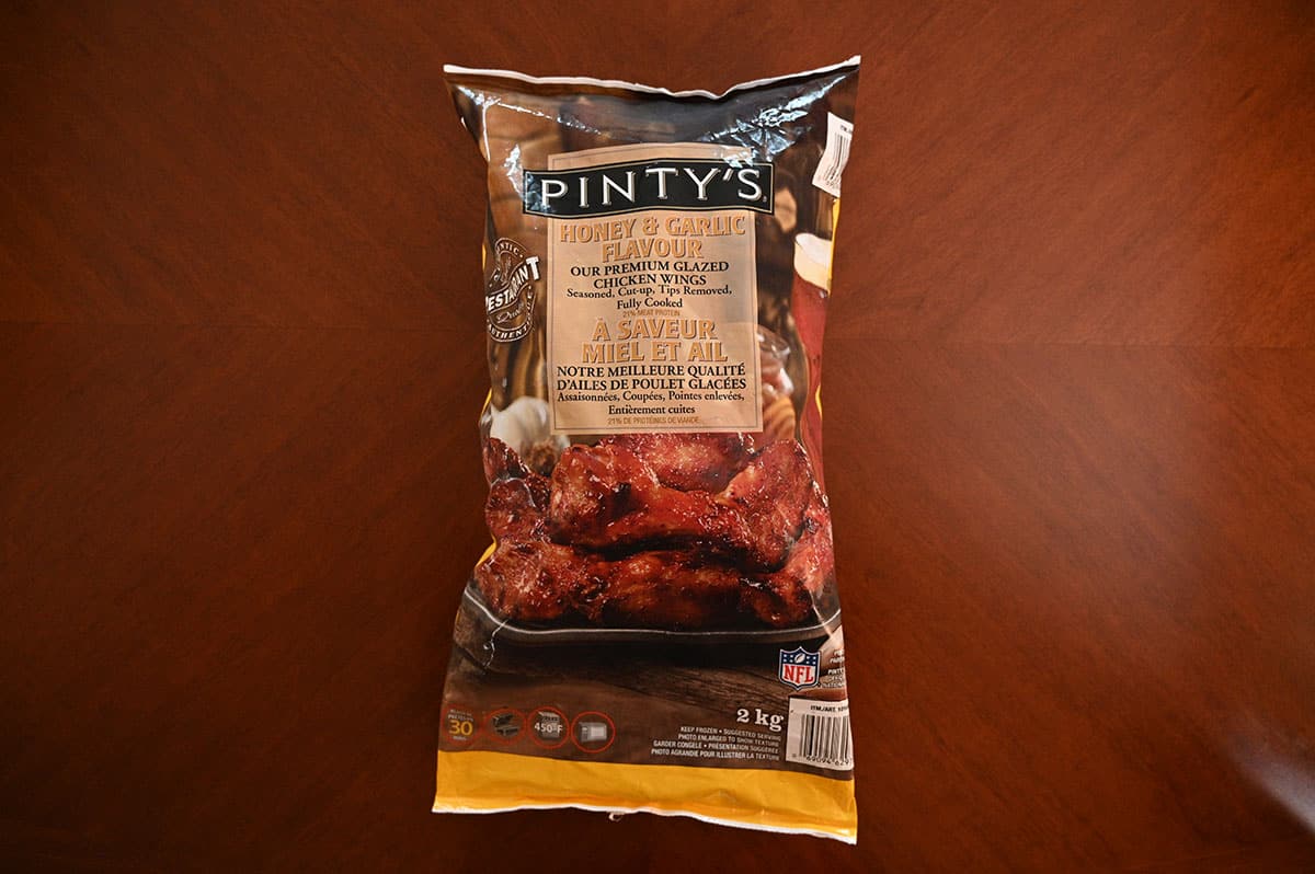 Costco Pinty's Honey & Garlic Wings bag on a table.