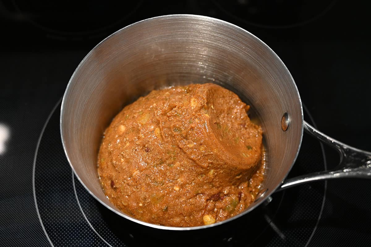 Image of the chili in a saucepan cooking on the stove.