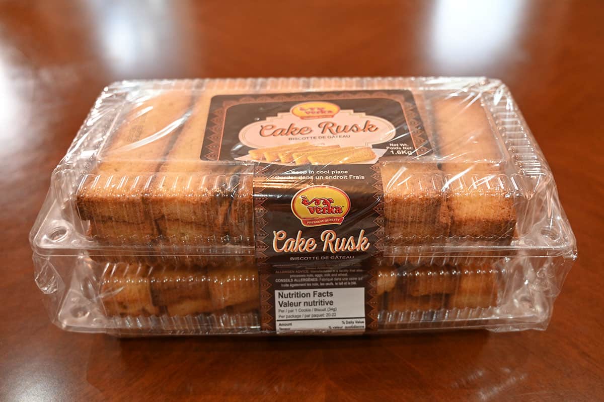 Side view image of the cake rusks in their package on a  wood table.