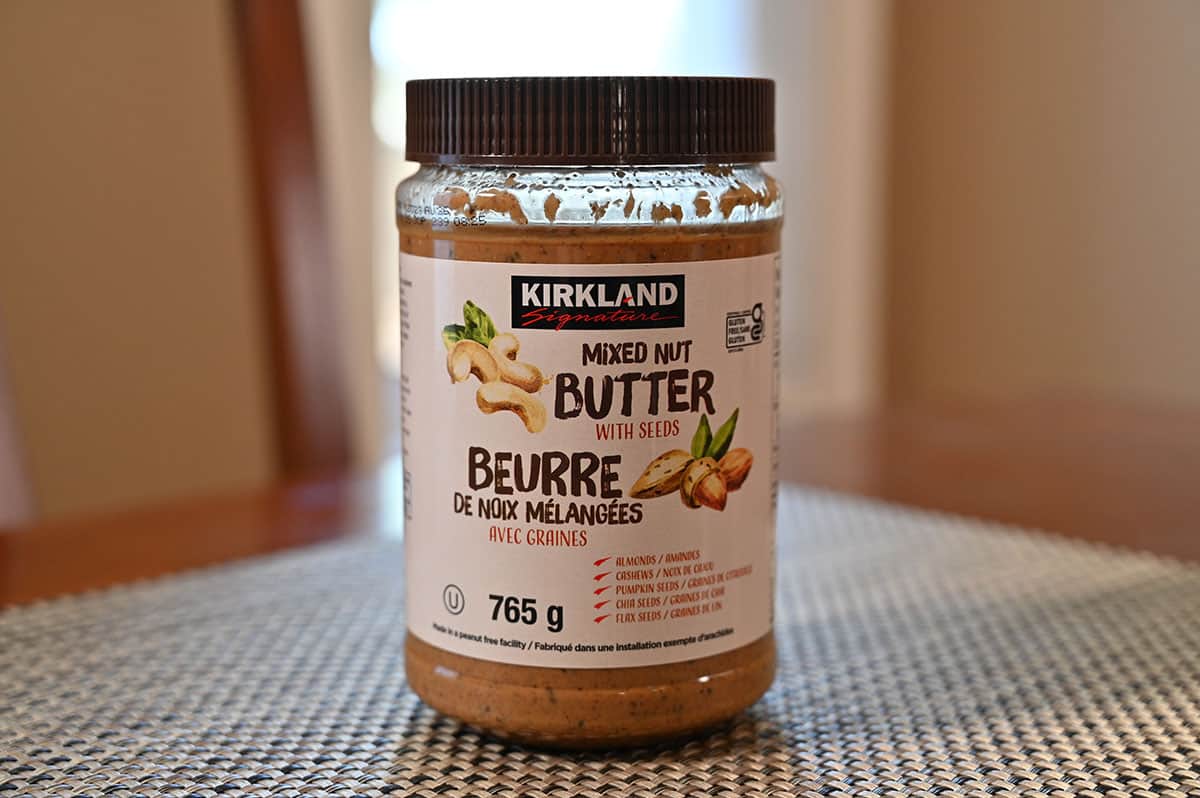 Costco Kirkland Signature Mixed Nut Butter container sitting on a table.