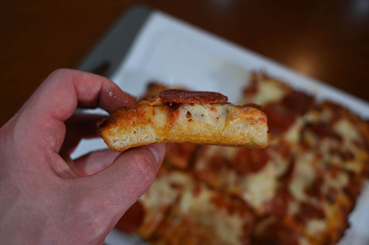 Closeup side view image of the pizza so the crust is visible.