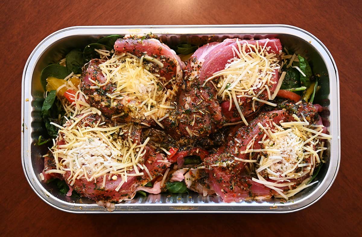 Image of the stuffed pork tenderloin meal with the lid off, prior to cooking.