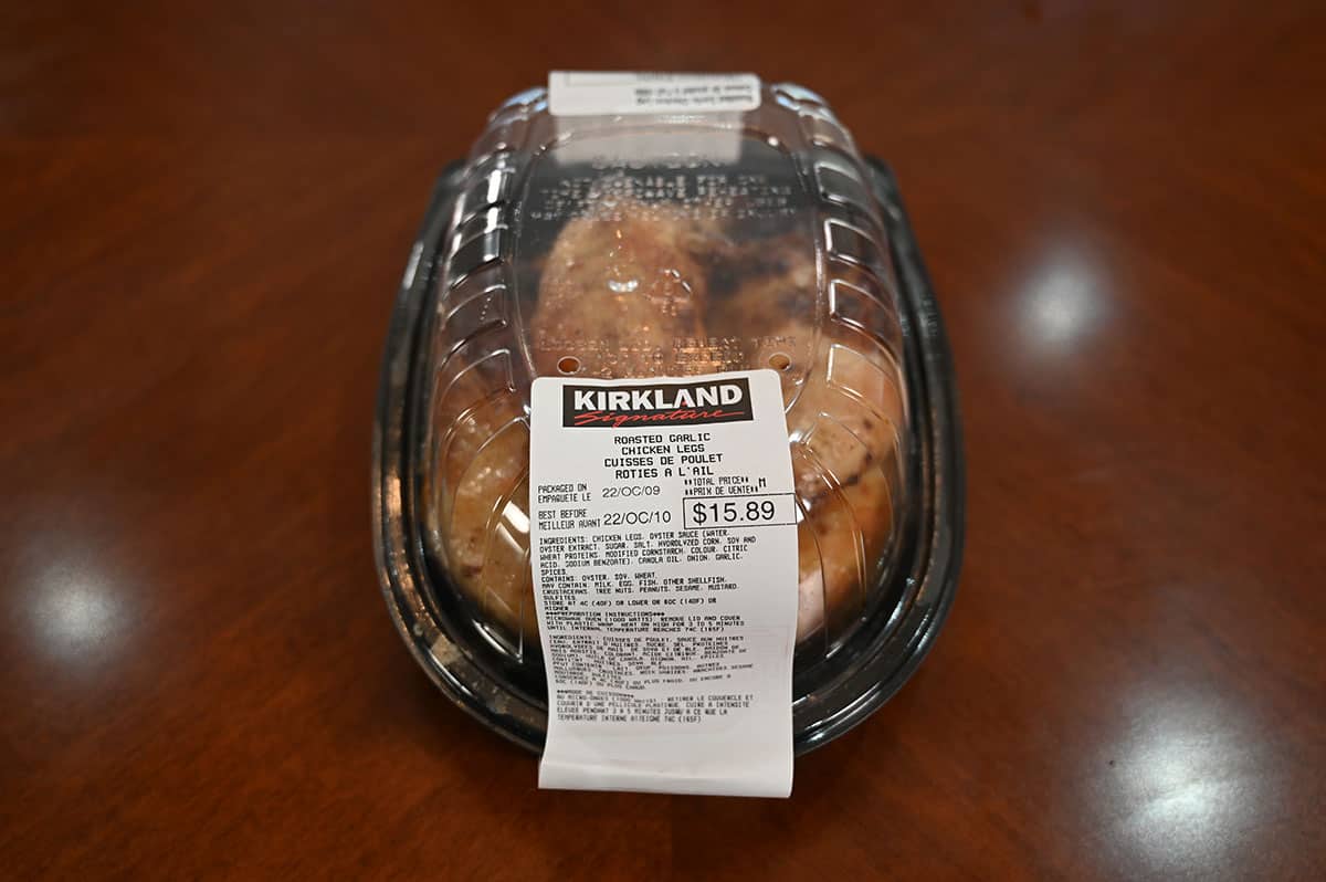 Image of the Costco Kirkland Signature Roasted Garlic Chicken Legs package sitting on a table.