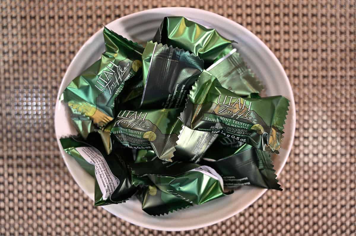 Image showing a bowl of mint chocolate truffles, showing that they're individually wrapped.