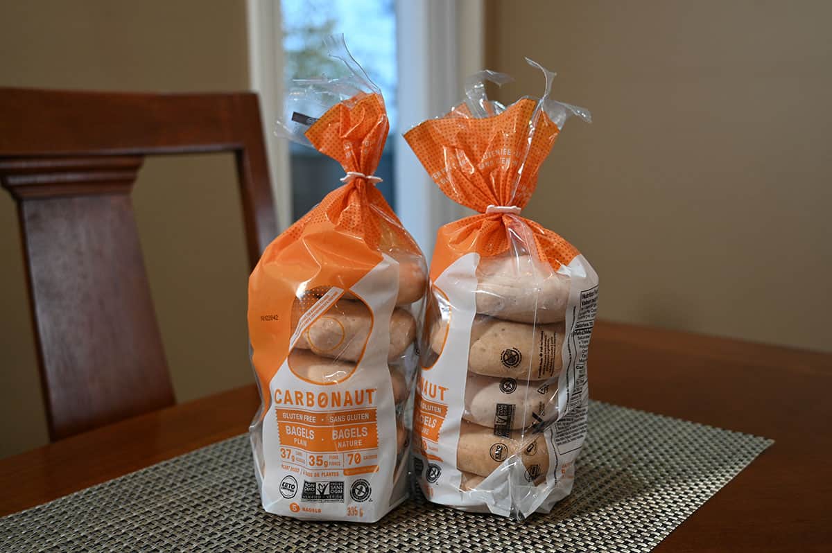 Image of two bags of bagels sitting on a table.