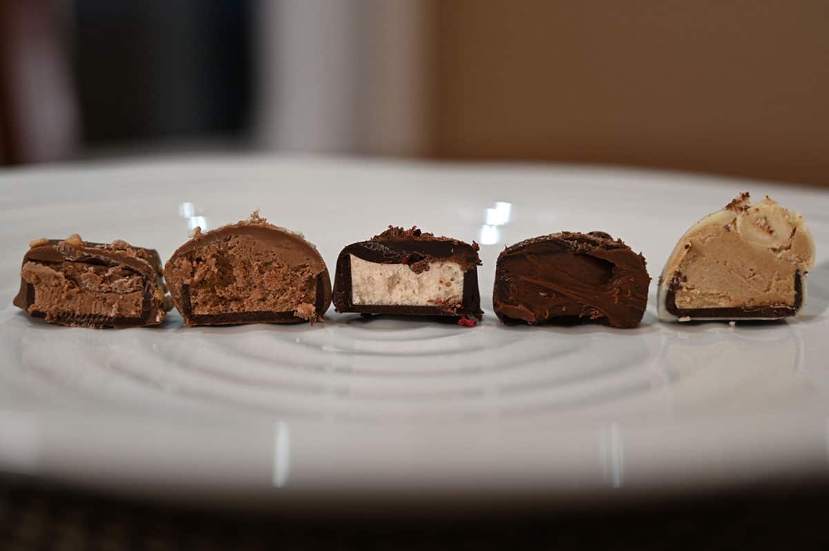 Closeup image of five chocolates cut in half so you can see the center.